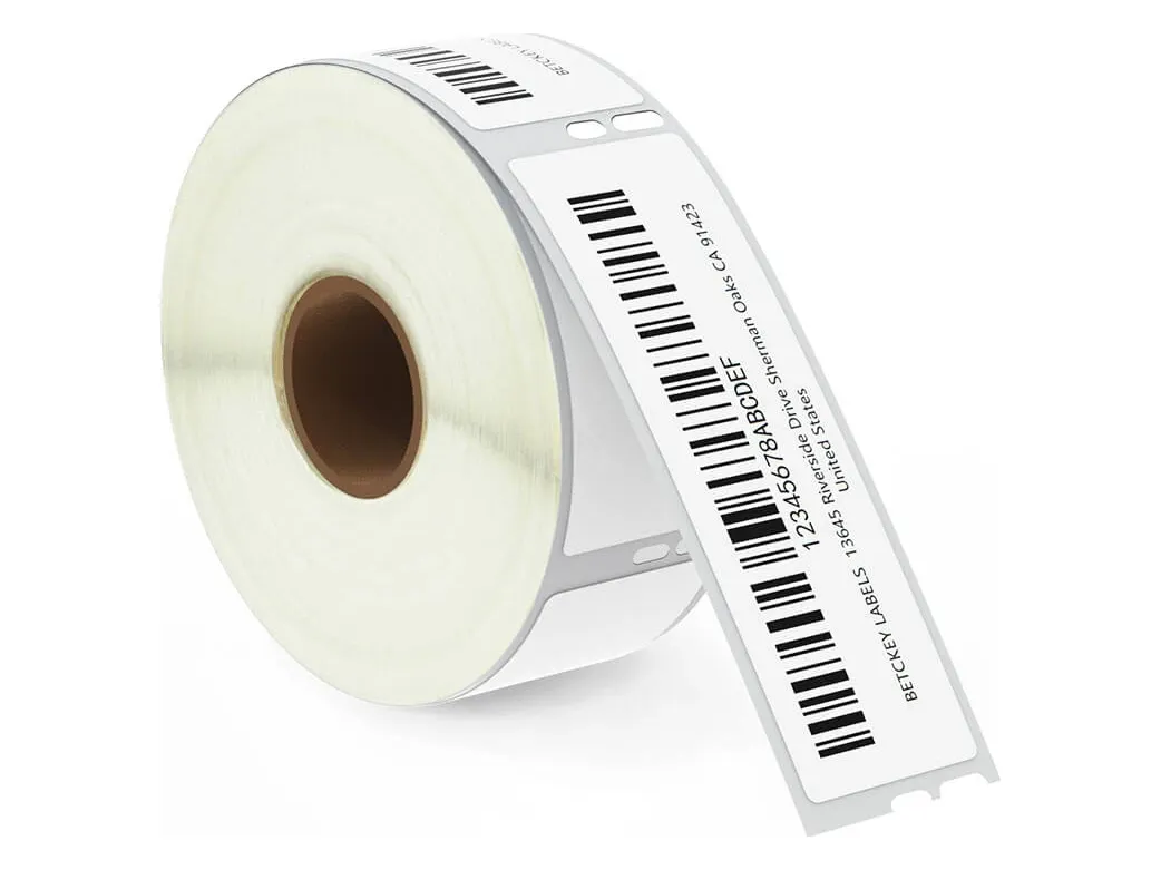 Roll of 1-1/8 x 3-1/2 inch address labels, one pulled out and printed with a sample barcode (DYMO 30252 size)